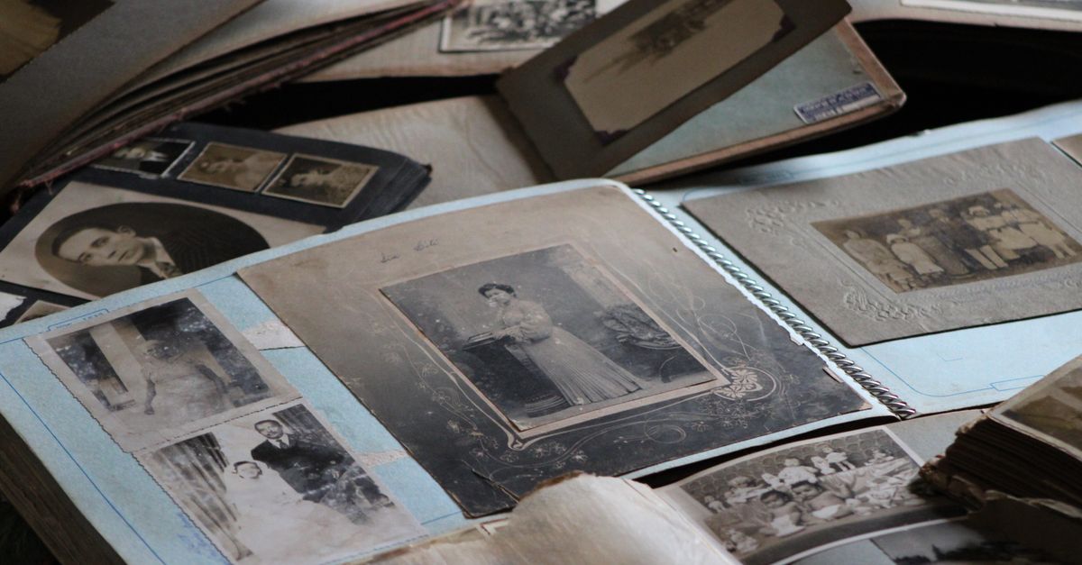 Explore vintage family photo albums filled with black and white photographs, capturing timeless memories.